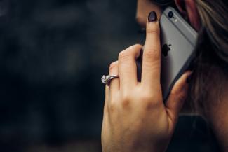 woman talking on the phone by Taylor Grote courtesy of Unsplash.